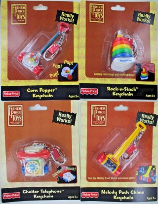 Set Of 4 Fisher - Price Keychains Keyrings Mini Toys Popper Stack Chime Phone Doll
