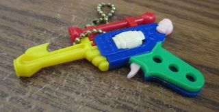 Vintage Plastic Keychain Puzzle Ray Gun