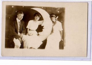 Real Photo Postcard Rppc - Man And Two Women On Paper Moon Studio Prop