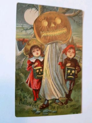 Halloween Postcard With Pumpkin Headed Ghost And 2 Children With Lanterns
