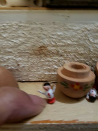 miniature vintage handmade and painted wooden eggs with little people inside 7 7