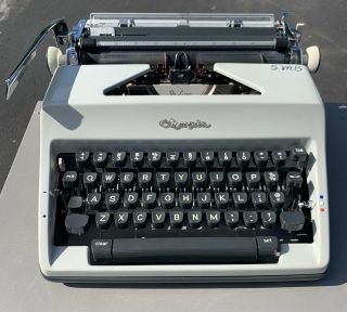 Olympia Sm - 9 Portable Typewriter Cursive Script Typeset