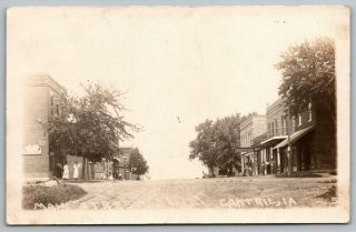 Cantril Iowa Dirt Main Street A Few Patrons By Shops,  But No Vehicles Rppc 1918