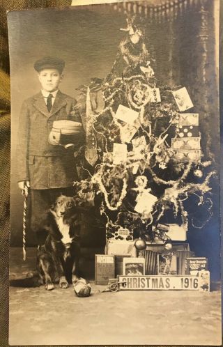 1916 Real Photo Postcard Christmas Tree Presents Boy Dog Motorcycle Helmet Toys