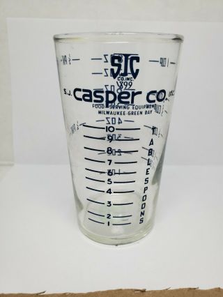 Vintage Advertising Measuring Glass - S.  J.  Casper Co.  Inc.  (black) (1070)