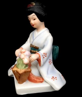 Bisque Porcelain Geisha with Flowers Figurine. 2