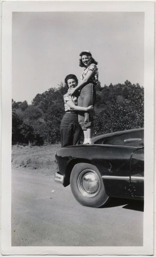 Two Pretty Young Women Embrace On Vintage Car Lesbian Int At Garden Of The Gods