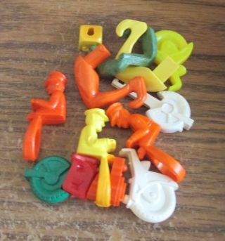 Vintage Plastic Keychain Puzzle Parts For Motorcycle Cop And Contorshionist