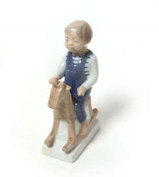 Porcelain Figurine Boy With Rocking Horse.  Denmark,  Royal Copenhagen 5196.