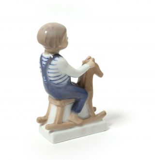 Porcelain figurine Boy with rocking horse.  Denmark,  Royal Copenhagen 5196. 3