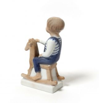 Porcelain figurine Boy with rocking horse.  Denmark,  Royal Copenhagen 5196. 4