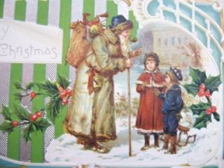 A Marry Christmas Santa With Brown Coat Blue Hat Talking Kids Art Deco Postcard