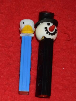 Vintage Snowman Pez Dispenser Black Body No Feet And One Vintage Donald Duck
