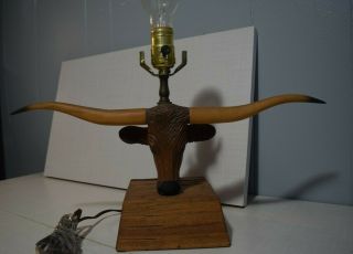 A Brandt Ranch Oak Longhorn Lamp with shade and finial 10