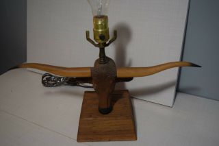 A Brandt Ranch Oak Longhorn Lamp with shade and finial 6