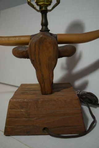 A Brandt Ranch Oak Longhorn Lamp with shade and finial 8
