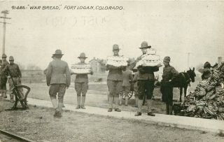 Wwi Era Postcard Fort Logan Near Denver Co Soldiers Carry Loaves Of " War Bread "