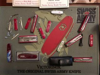 Swiss Army Knives,  Dealer Mat,  And Two Out Of Print Books