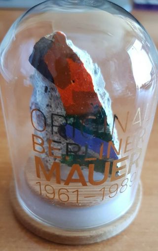 Colorful Piece Of The Berlin Wall In Glass Display With