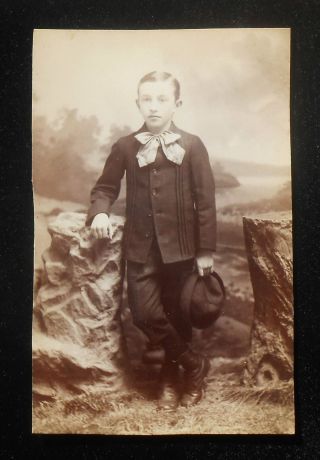 Rppc 1900s Portrait Of A Dapper Young Boy With Hat And Large Bowtie