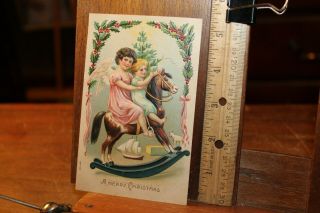 Antique Embossed Post Card 1908 German A Merry Christmas Angel Child Rocking