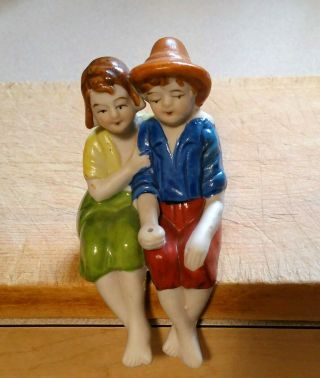 Vintage Occupied Japan Boy & Girl Bisque? Figurine Shelf Sitters Legs Hang Over