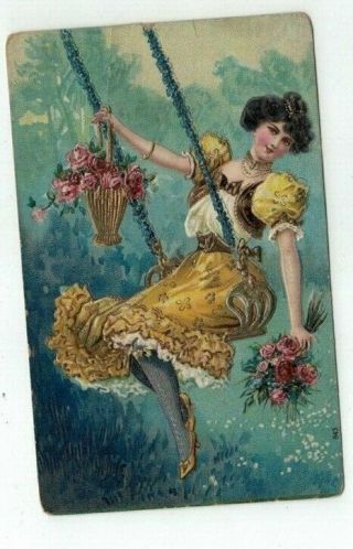 Antique Embossed Uncaptioned Post Card Lady On A Swing With Flowers