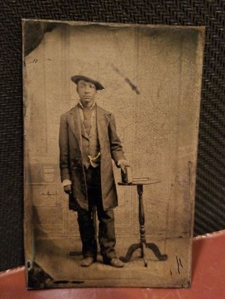 African American Sixth Plate Tintype - A Man Wearing A Hat And Holding A Book.