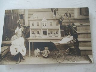 Antique Photo Postcard Of Small Girl With Dollhouse,  Dolls Etc.  (unposted)