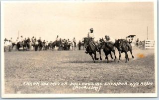 Sheridan,  Wyoming Rodeo Rppc Postcard " Frank Van Meter Bulldogging " Doubleday