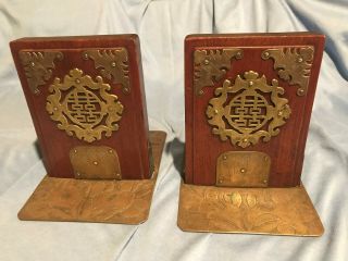 Vintage Decorative Brass Emblems On Wood Bookend Set With A Brass Base