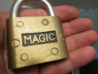 old brass padlock lock MAGIC with a key.  n/r 2