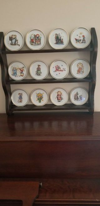 12 Berta Hummel Mini Plates With Shelf.  1970 