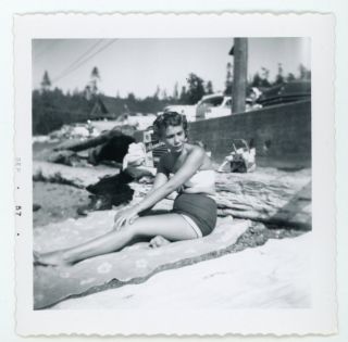 Leggy Gal Sunbathing On The Beach In Bathing Suit Vintage Snapshot Photo