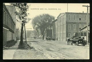 Postcard - Street Scene W Sandwich Manufacturing Co.  Dekalb County Illinois 1910