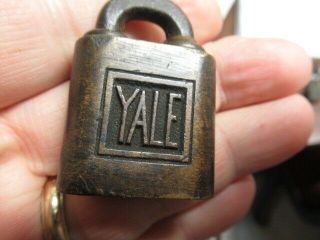 Old brass miniature YALE ptpk push padlock lock with a key and odd shackle.  n/r 2