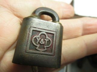 Old brass miniature YALE ptpk push padlock lock with a key and odd shackle.  n/r 3