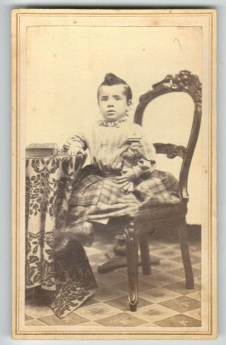 CDV Young Afro - American Slave with number 115 and her bags around her waist. 6