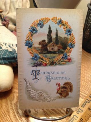 Vintage Thanksgiving Postcard Turkey Under Blue Yellow Flower Wreath