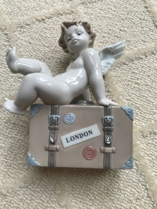 Lladro 010.  07310 “ Angel Sitting On London Suitcase”