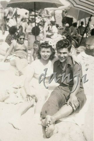 Cute Couple Sitting On The Beach With Their Feet In The Camera Old Photo