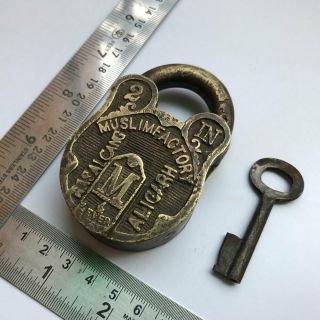 An old antique solid brass padlock lock with key and carving 2