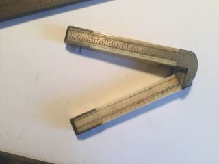 Antique folding rulers: 2 12 and 24 inch ivory 39 and wood 62 3