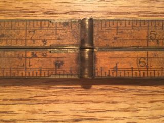 Antique folding rulers: 2 12 and 24 inch ivory 39 and wood 62 6