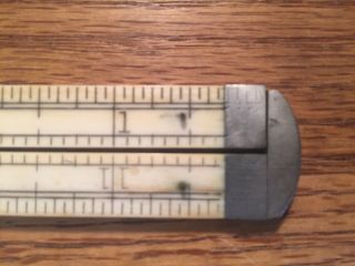 Antique folding rulers: 2 12 and 24 inch ivory 39 and wood 62 7