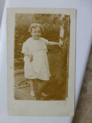 Rppc Smiling Little Barefoot Girl On Wicker Chair Antique Real Photo Postcard