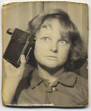 Young Woman Holds Up Vintage Portable Transistor Radio In Unusual Photobooth