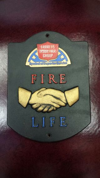 Rare Farmers Insurance Group Cast Iron Building Plaque Fire Life Handshake