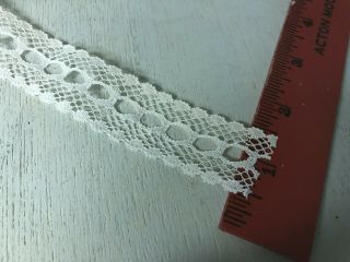 65 yd roll of vintage cotton lace trim with holes to weave ribbon.  1 