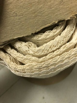 65 yd roll of vintage cotton lace trim with holes to weave ribbon.  1 